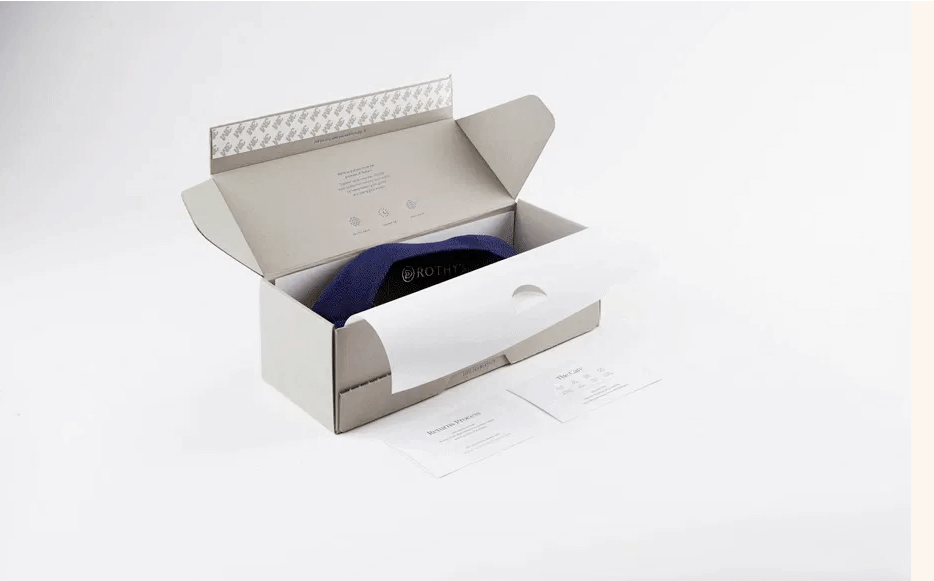 Rothy's custom shoebox. Shoebox is open and has purple shoe inside.